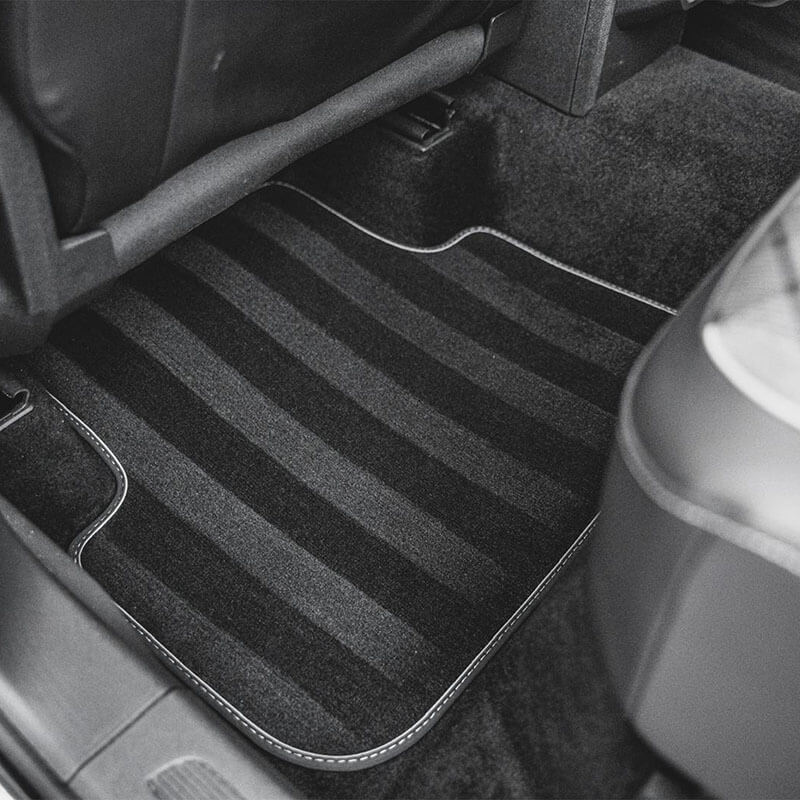 Freshly vacuumed rear floor carpet with clean stripe pattern