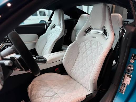 Clean white diamond-stitched sport seats
