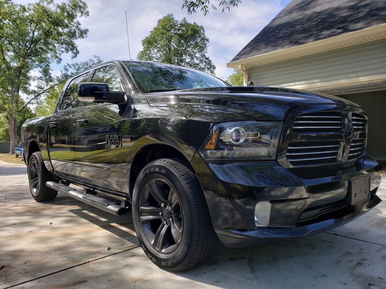 Black Ram 1500 with mirror-like paint finish after a full detail
