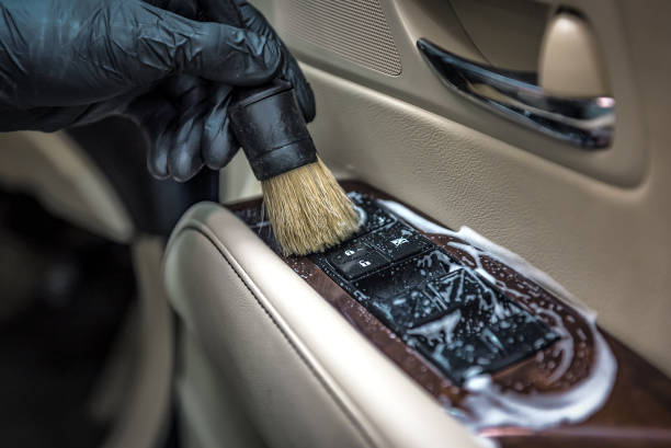 Detail brush cleaning interior trim and buttons